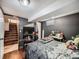 Cozy bedroom featuring hardwood floors and neutral grey tones, creating a relaxing atmosphere at 7870 Kimberly St, Commerce City, CO 80022