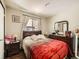 Cozy bedroom features a large window and a comfortable bed at 7870 Kimberly St, Commerce City, CO 80022