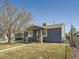 Exterior showcasing the side yard, shed, and well-kept lawn at 7870 Kimberly St, Commerce City, CO 80022