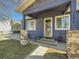 Charming front entrance with stone accents and well-maintained landscaping at 7870 Kimberly St, Commerce City, CO 80022