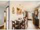 Eat-in kitchen features wood floors and dark countertops at 7870 Kimberly St, Commerce City, CO 80022