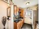 Compact kitchen featuring granite countertops and ample cabinet space at 7870 Kimberly St, Commerce City, CO 80022