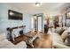 Open living space with hardwood floors and a seamless flow to the kitchen at 7870 Kimberly St, Commerce City, CO 80022