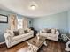 Bright living room with hardwood floors and stylish furnishings at 7870 Kimberly St, Commerce City, CO 80022