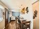 Open-concept living area with hardwood floors and modern decor at 7870 Kimberly St, Commerce City, CO 80022