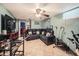 Cozy basement living room with tile flooring and large sectional sofa at 7870 Kimberly St, Commerce City, CO 80022