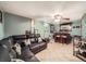 Finished basement living area with tile floor, ceiling fan, and leather sofa at 7870 Kimberly St, Commerce City, CO 80022
