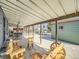 Covered patio with wooden furniture, great for outdoor entertainment and relaxation at 7870 Kimberly St, Commerce City, CO 80022