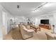 Basement with carpet and track lighting, showcasing a comfortable seating area and entertainment space at 6023 E 6Th Avenue Pkwy, Denver, CO 80220
