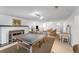 Spacious basement featuring a fireplace, ping pong table and seating area with plenty of room for activities and relaxation at 6023 E 6Th Avenue Pkwy, Denver, CO 80220