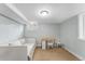 Cozy bedroom with a comfortable bed, a built-in desk and a window offering natural light in a finished basement at 6023 E 6Th Avenue Pkwy, Denver, CO 80220