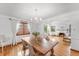 Elegant dining room with hardwood floors, chandelier, and lots of natural light at 6023 E 6Th Avenue Pkwy, Denver, CO 80220