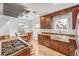Modern kitchen with stainless steel appliances, granite counters, and eat in area at 6023 E 6Th Avenue Pkwy, Denver, CO 80220