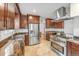 Open kitchen featuring stainless steel appliances, granite countertops, and ample cabinet space at 6023 E 6Th Avenue Pkwy, Denver, CO 80220