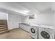 Functional laundry room with modern washer and dryer, countertop and storage, perfect for tackling household tasks at 6023 E 6Th Avenue Pkwy, Denver, CO 80220
