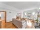 Bright living room with hardwood floors, arched doorway, and ample natural light at 6023 E 6Th Avenue Pkwy, Denver, CO 80220