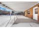 Covered patio with brick walls and concrete flooring at 914 Quari Ct, Aurora, CO 80011