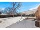 Snowy backyard with a covered patio and privacy fence, perfect for outdoor activities and relaxation at 914 Quari Ct, Aurora, CO 80011