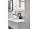 Bathroom vanity with white sink and black faucet at 914 Quari Ct, Aurora, CO 80011