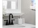 Bathroom vanity with white sink and black faucet at 914 Quari Ct, Aurora, CO 80011