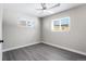 Bright bedroom with ceiling fan and gray flooring at 914 Quari Ct, Aurora, CO 80011