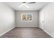 Well-lit bedroom featuring a ceiling fan and wood-like flooring at 914 Quari Ct, Aurora, CO 80011