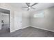 Bedroom with ceiling fan, gray flooring, and closet at 914 Quari Ct, Aurora, CO 80011