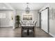 Charming dining room with a wooden table and modern chandelier at 914 Quari Ct, Aurora, CO 80011