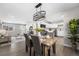 Open concept dining area with kitchen view and stylish light fixture at 914 Quari Ct, Aurora, CO 80011