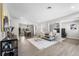 Bright living room with hardwood floors, modern fireplace, and large windows at 914 Quari Ct, Aurora, CO 80011