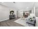 Bright, open living room with wood floors, modern decor, and seamless flow into the dining area at 914 Quari Ct, Aurora, CO 80011