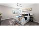 Main bedroom with a ceiling fan and large window at 914 Quari Ct, Aurora, CO 80011