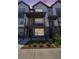 Beautiful two-story home featuring a private covered balcony, brick accents, and landscaped front yard at 12336 W 52Nd Ave, Wheat Ridge, CO 80033