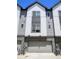 A lovely home featuring an attached two-car garage, stone accents, and neutral color siding at 12336 W 52Nd Ave, Wheat Ridge, CO 80033