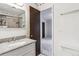 Bright bathroom featuring a tub/shower combo and granite countertop at 3616 W Radcliff Ave, Denver, CO 80236
