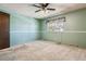 Bedroom with teal walls and ceiling fan at 3616 W Radcliff Ave, Denver, CO 80236