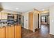 Modern kitchen with stainless steel appliances, granite countertops, and updated backsplash at 3616 W Radcliff Ave, Denver, CO 80236