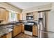 Well-equipped kitchen with stainless steel appliances and stylish granite countertops at 3616 W Radcliff Ave, Denver, CO 80236