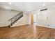 Bright living room showcasing a staircase, beautiful flooring, and natural light at 3616 W Radcliff Ave, Denver, CO 80236