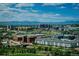 Scenic aerial view showcasing the cityscape, with a river winding through the foreground and mountains in the distance at 1700 Bassett St # 1808, Denver, CO 80202