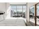 Bright bedroom featuring a large window with city views and a modern, minimalist aesthetic at 1700 Bassett St # 1808, Denver, CO 80202