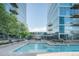 Outdoor pool surrounded by modern buildings and lush landscaping at 1700 Bassett St # 1808, Denver, CO 80202