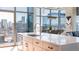 Modern kitchen island with bar seating overlooking city views, perfect for entertaining at 1700 Bassett St # 1808, Denver, CO 80202