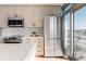 Contemporary kitchen with stainless steel appliances, light wood cabinetry, and a bright, airy feel at 1700 Bassett St # 1808, Denver, CO 80202