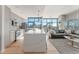 Modern living space with a kitchen island, cityscape views, and an inviting open layout at 1700 Bassett St # 1808, Denver, CO 80202