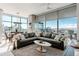Comfortable living room boasting floor-to-ceiling windows and stylish decor with captivating cityscape views at 1700 Bassett St # 1808, Denver, CO 80202