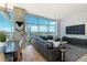 Bright living room with floor-to-ceiling windows, comfortable seating, and captivating city and mountain views at 1700 Bassett St # 1808, Denver, CO 80202