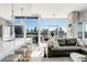 Open-concept living space with floor-to-ceiling windows offering stunning views of the cityscape at 1700 Bassett St # 1808, Denver, CO 80202
