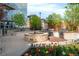 Outdoor patio featuring a fire pit, grill, and landscaped surroundings at 1700 Bassett St # 1808, Denver, CO 80202