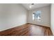 Bedroom with wood floor, window, and a ceiling fan at 3205 E 102Nd Pl, Thornton, CO 80229